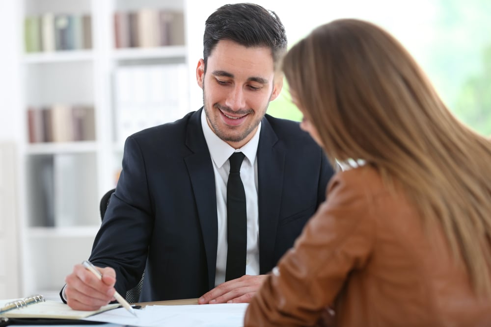 Woman meeting financial adviser in office