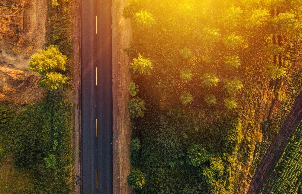 empty-road-through-countryside-in-sunset-aerial-v-2021-08-26-23-02-47-utc-1-1