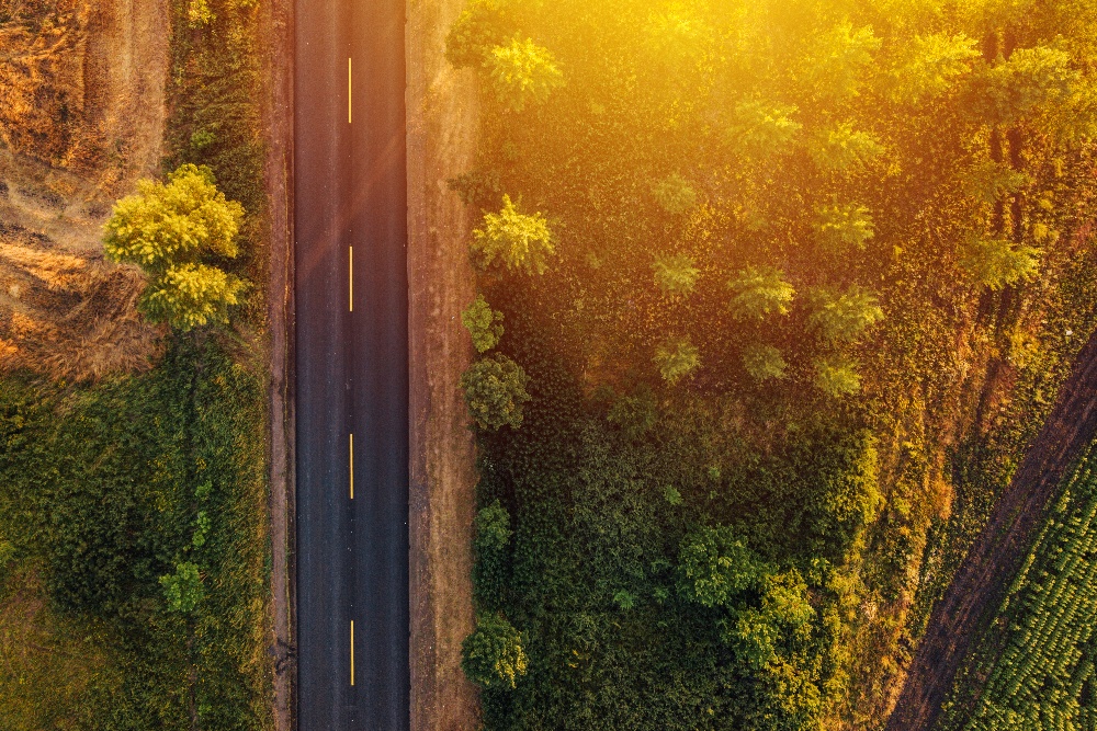 empty-road-through-countryside-in-sunset-aerial-v-2021-08-26-23-02-47-utc-1